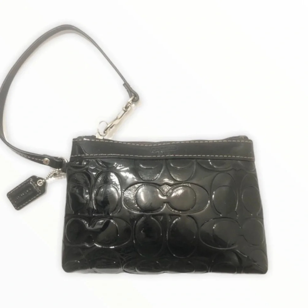 Coach embossed black leather wristlet clutch bag
